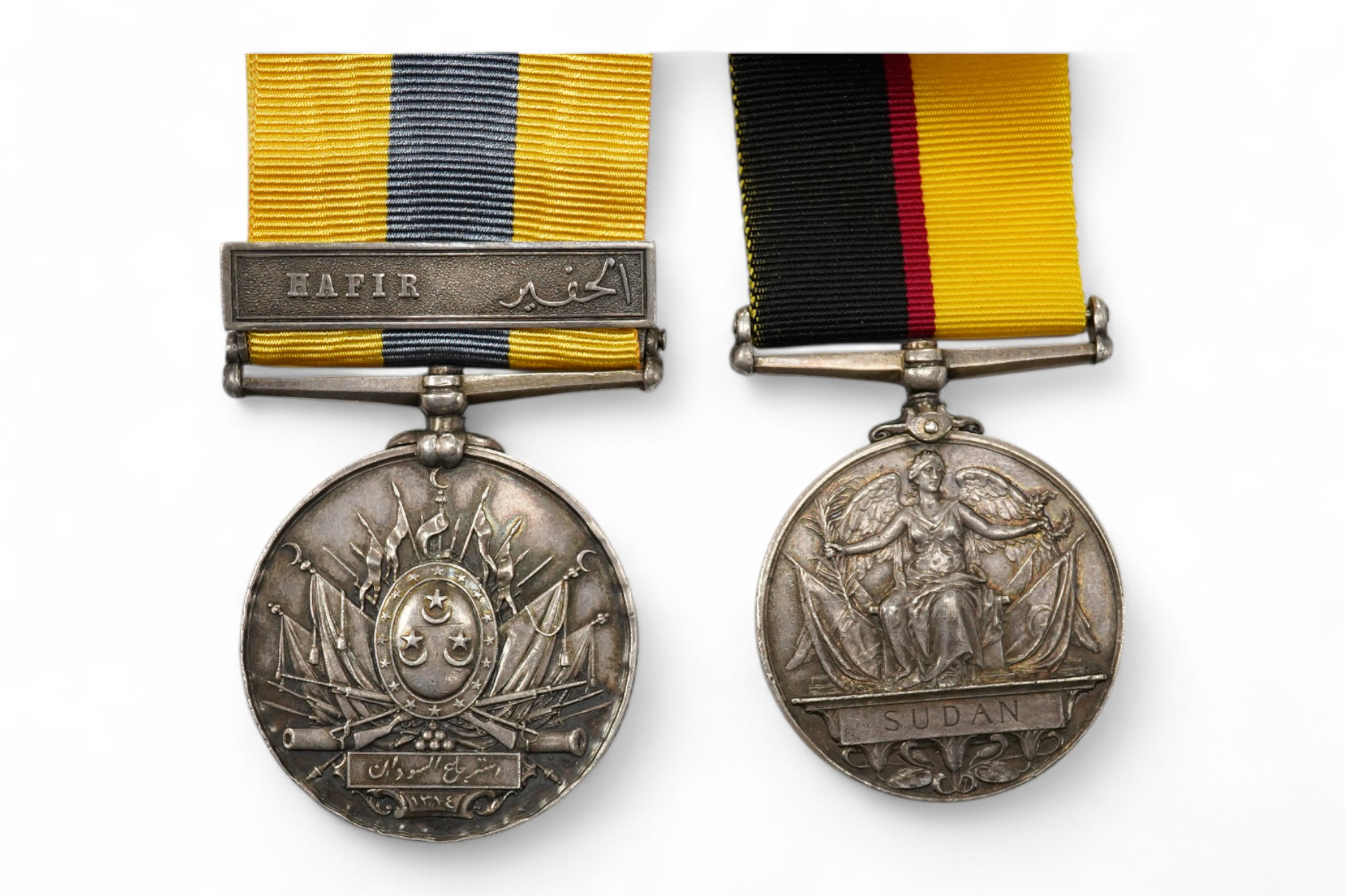 A Queen's Sudan Medal and a Khedive's Sudan (Hafir) Medal, both renamed to 4516 L Cpl W.J. Lee, Nth Stafford Rgt. Condition - fair.